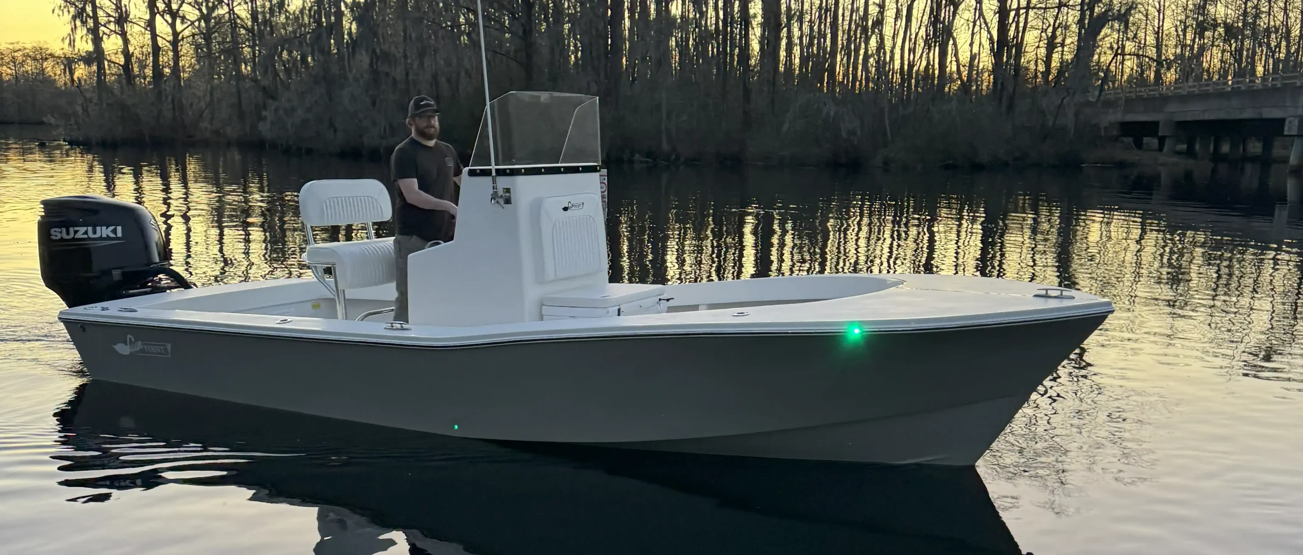 Gray Swan Point center-console boat at sunset
