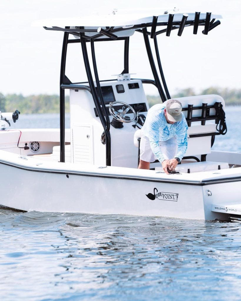 Angler aboard a Swan Point center-console boat